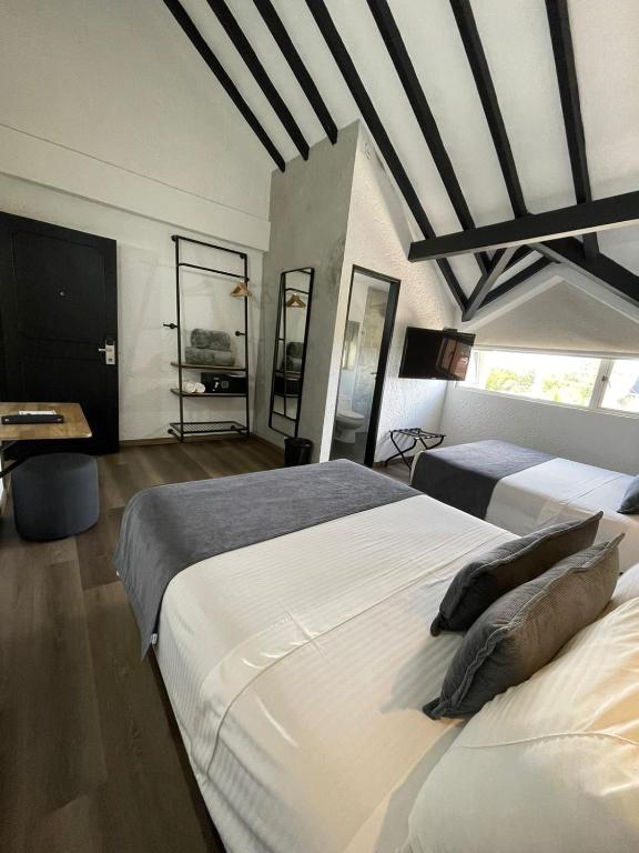 Postel nebo postele na pokoji v ubytování Hotel Santiago de Arma