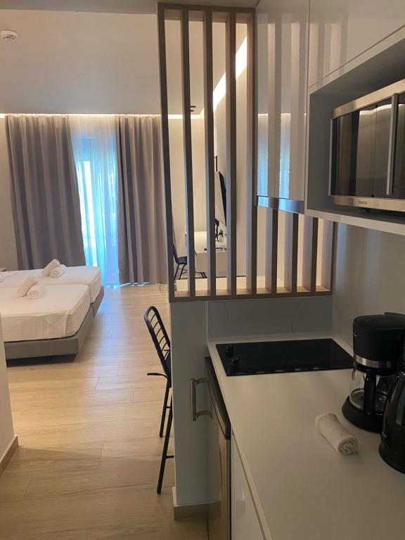 Postel nebo postele na pokoji v ubytování Barbie Hotel Apartments