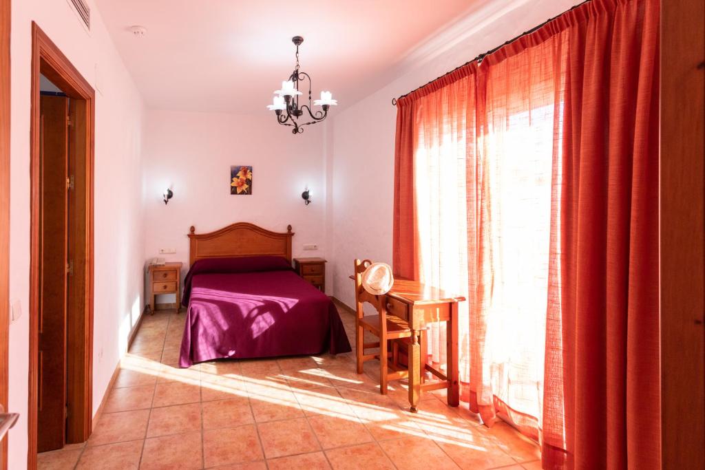 Posteľ alebo postele v izbe v ubytovaní Hotel Oasis Atalaya