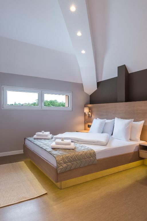Postel nebo postele na pokoji v ubytování Emilia Lux Rooms