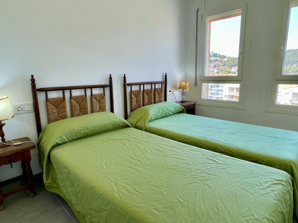 A bed or beds in a room at CAP CASTELL 8-A