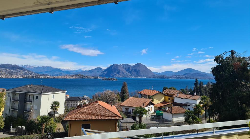 a view of a town with a lake and mountains at Castagneto House in Baveno