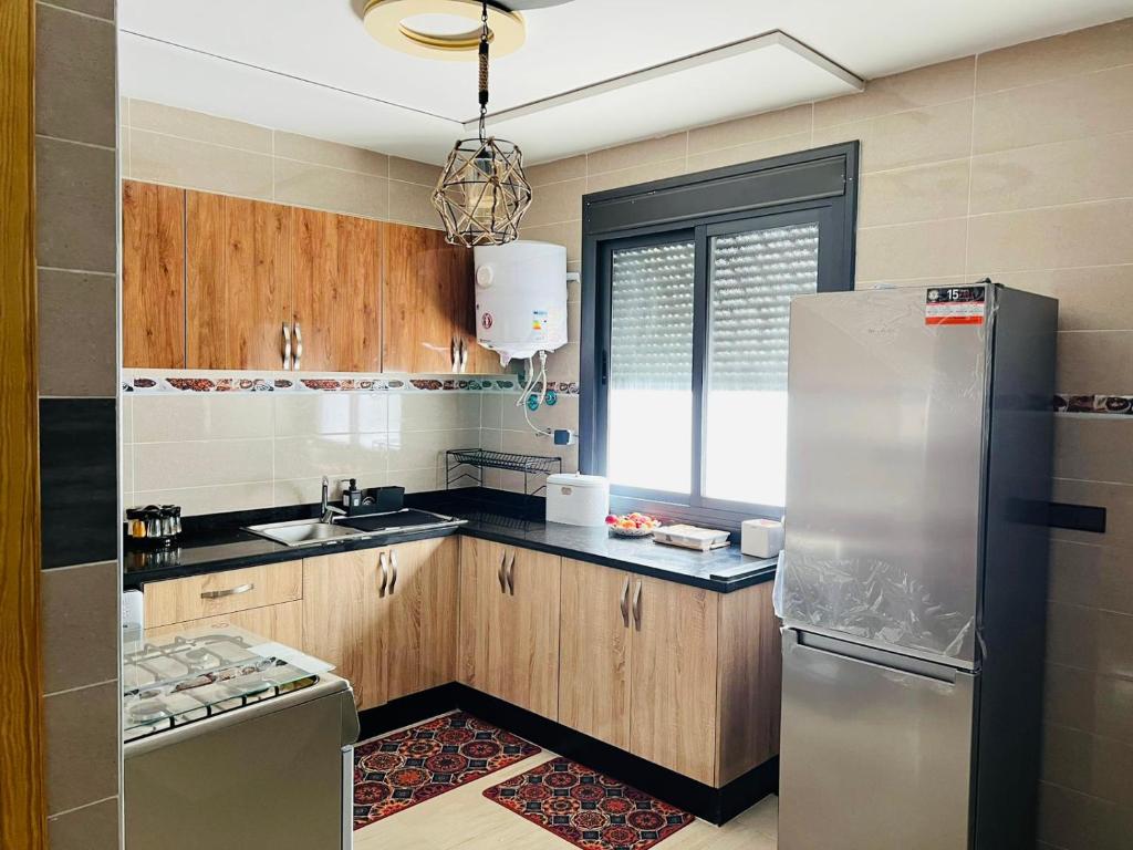 Kuchyň nebo kuchyňský kout v ubytování Appartement INES Saidia