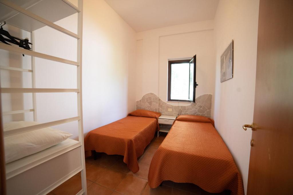 Postel nebo postele na pokoji v ubytování I Sapori Del Gargano