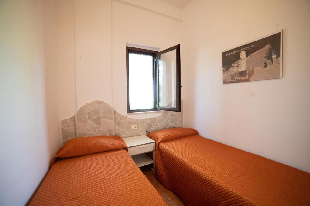 Postel nebo postele na pokoji v ubytování I Sapori Del Gargano