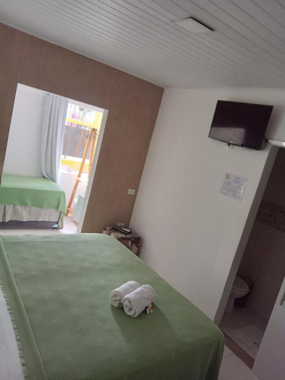 Postel nebo postele na pokoji v ubytování Pousada Familly -Praia de Tambaú -PB