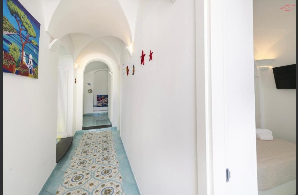A bed or beds in a room at Ravello Vingius Suite