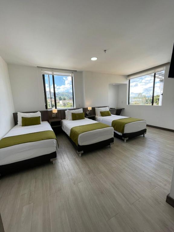Postel nebo postele na pokoji v ubytování Hotel Santiago de Arma
