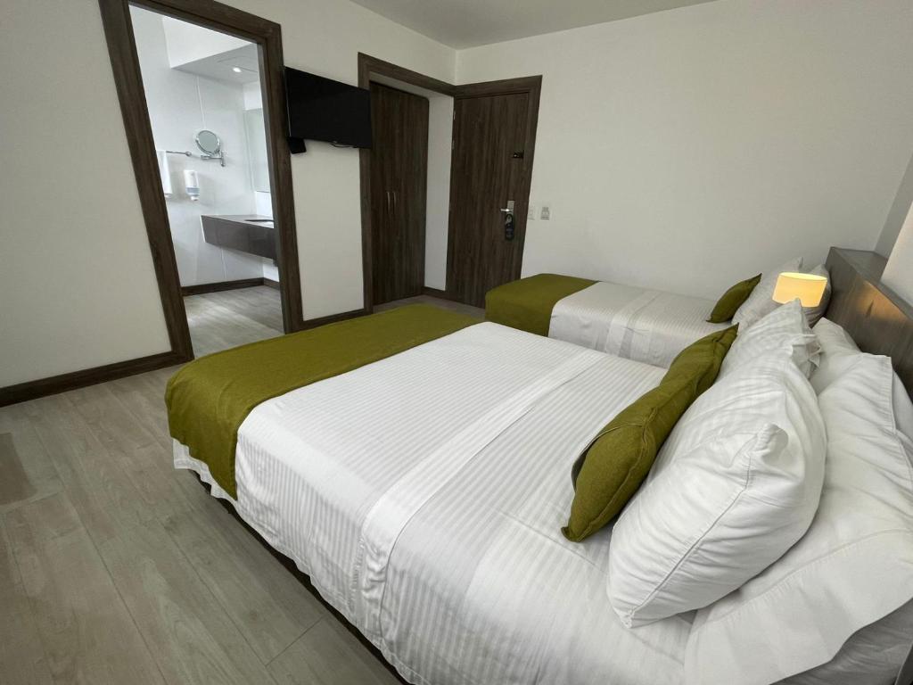 Postel nebo postele na pokoji v ubytování Hotel Santiago de Arma