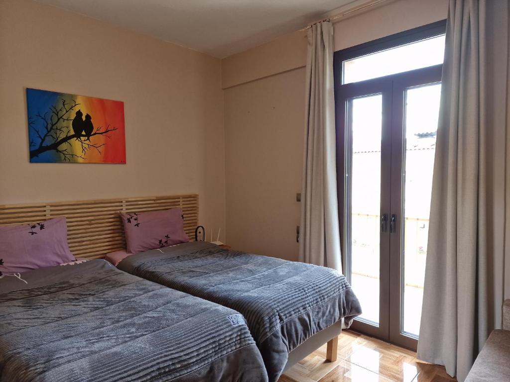 Postel nebo postele na pokoji v ubytování LIBERTY ΙΩΑΝΝΙΝΑ