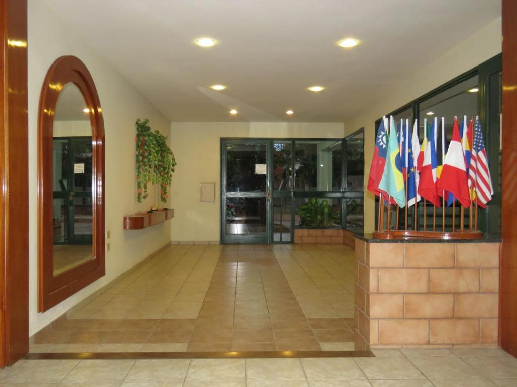 a lobby with several international flags in a building at EDIFICIO ASUNCIÓN in Asunción