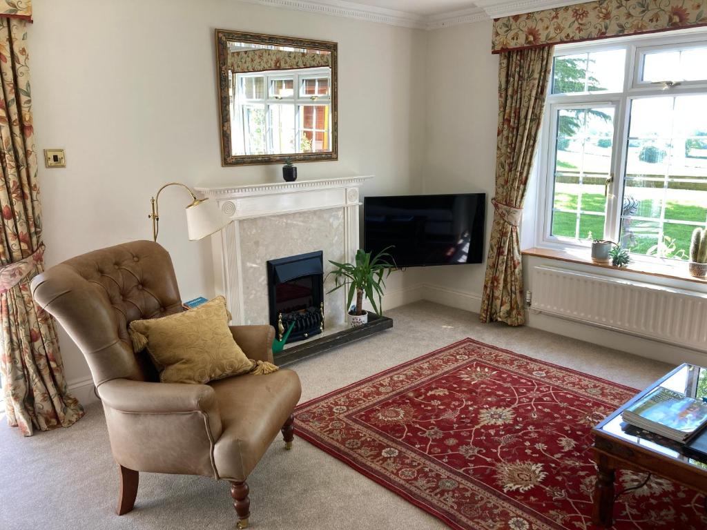 A seating area at Exclusive 1 or 2 Bedroom Apartment with Summer House and Hot Tub