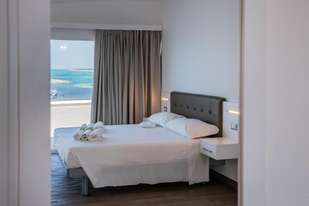Postel nebo postele na pokoji v ubytování Nauticus Hotel Ugento