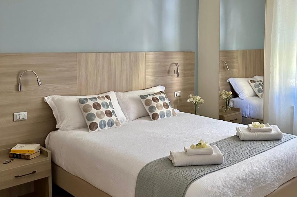 Un pat sau paturi într-o cameră la La Villetta del Golfo