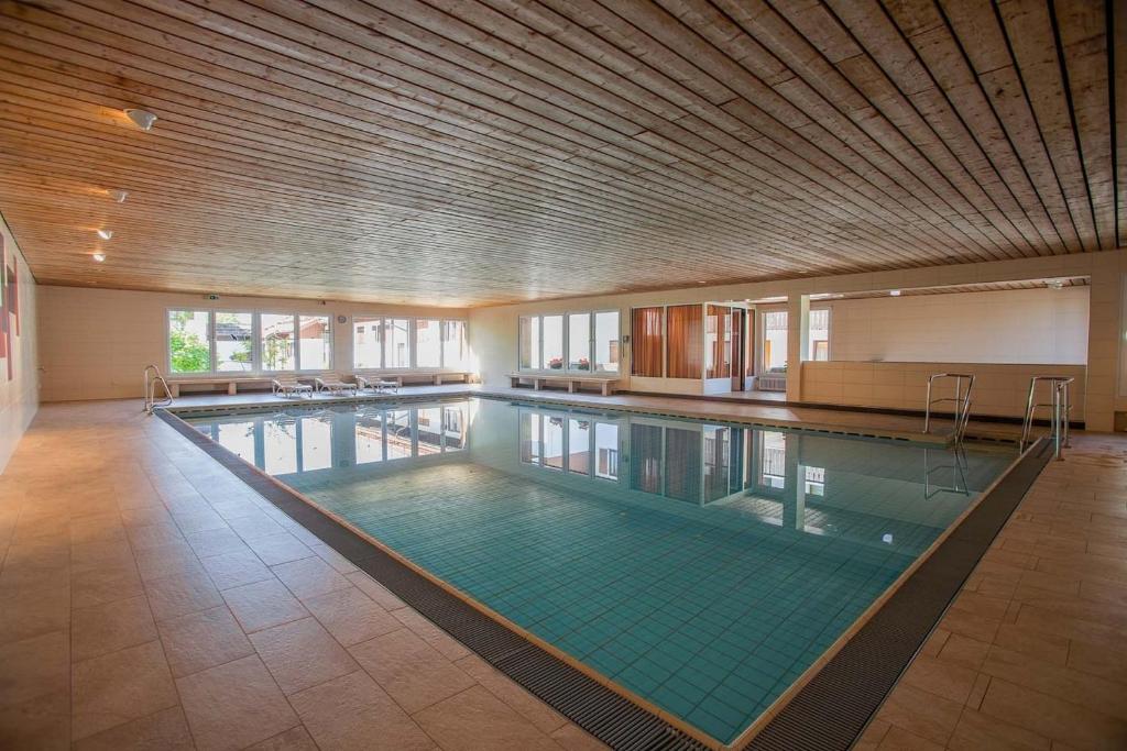 a large indoor swimming pool in a building at Appartment 1022, Missen-Wilhams in Missen-Wilhams