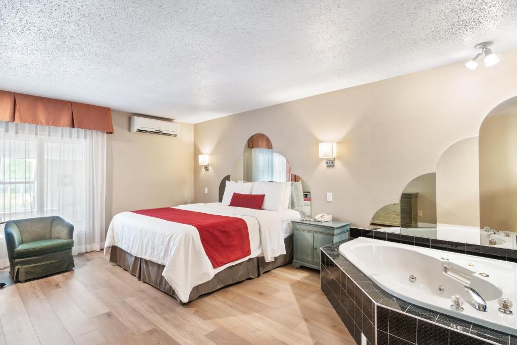 Postel nebo postele na pokoji v ubytování Hotel Bromont