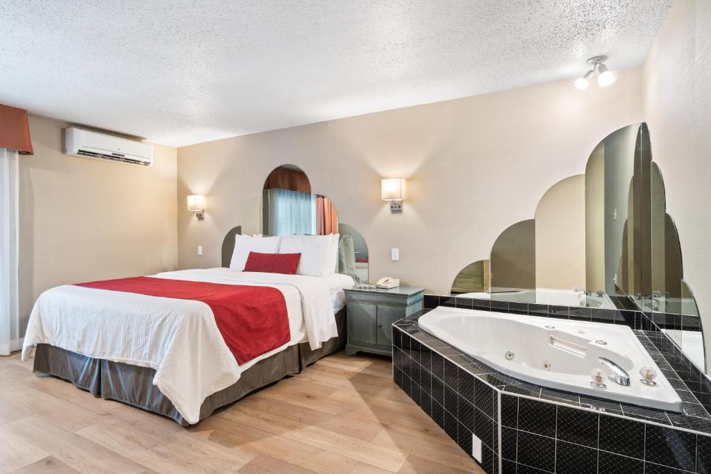 Postel nebo postele na pokoji v ubytování Hotel Bromont