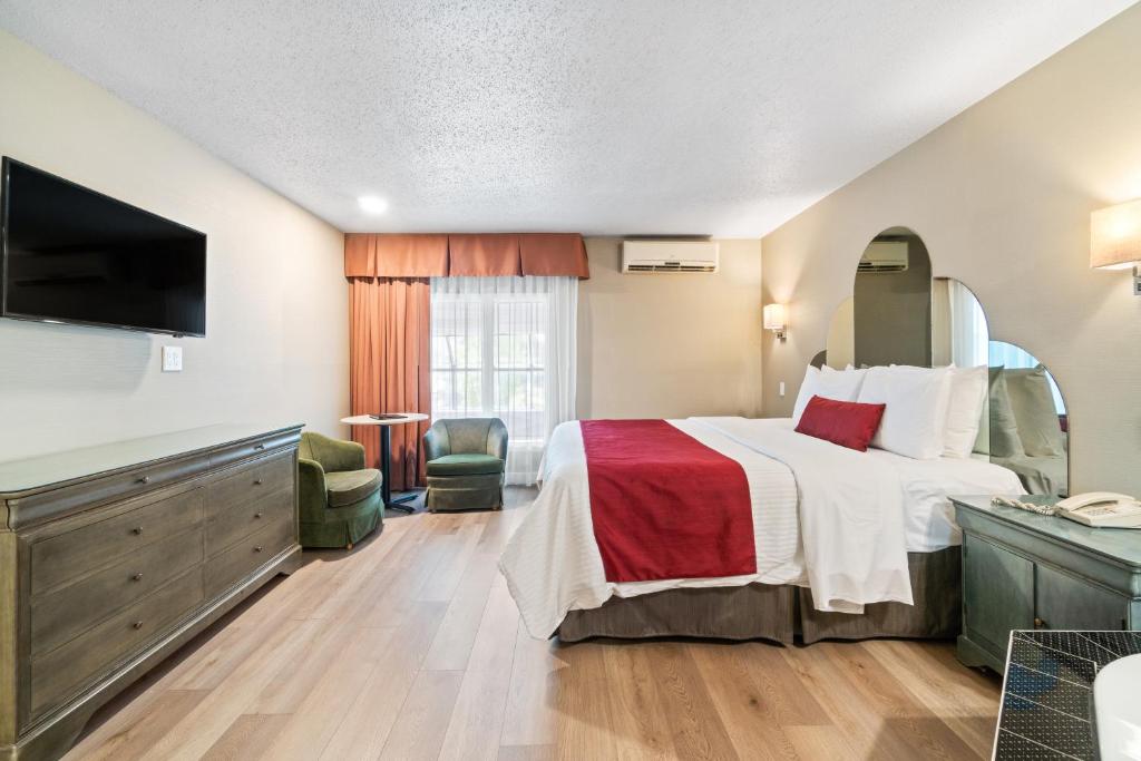 Postel nebo postele na pokoji v ubytování Hotel Bromont