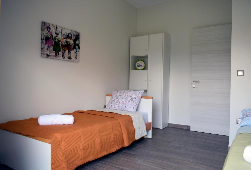 Postel nebo postele na pokoji v ubytování Thea Home