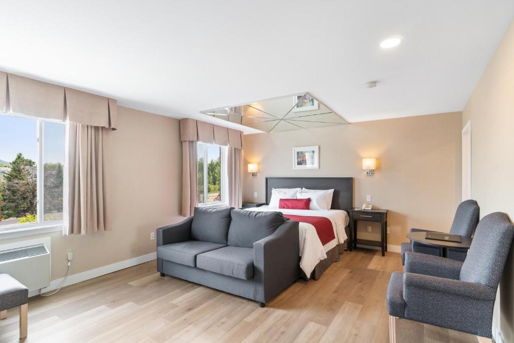 Postel nebo postele na pokoji v ubytování Hotel Bromont