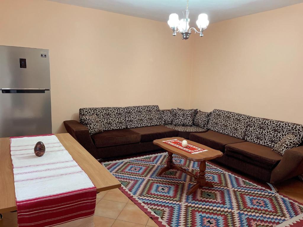 a living room with a couch and a table at Vila 8 Kruje in Krujë