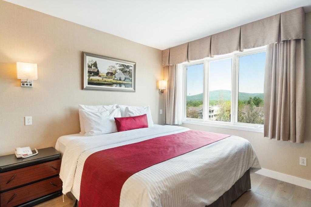 Postel nebo postele na pokoji v ubytování Hotel Bromont