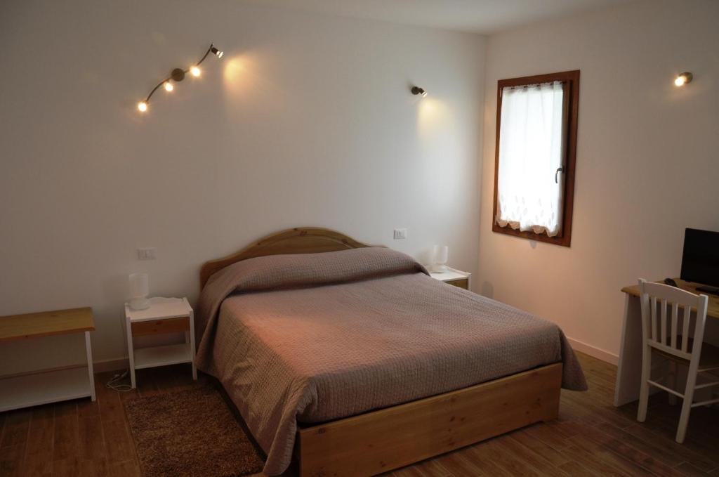 Postel nebo postele na pokoji v ubytování Hotel Agriturismo Al Luogo Del Giulio