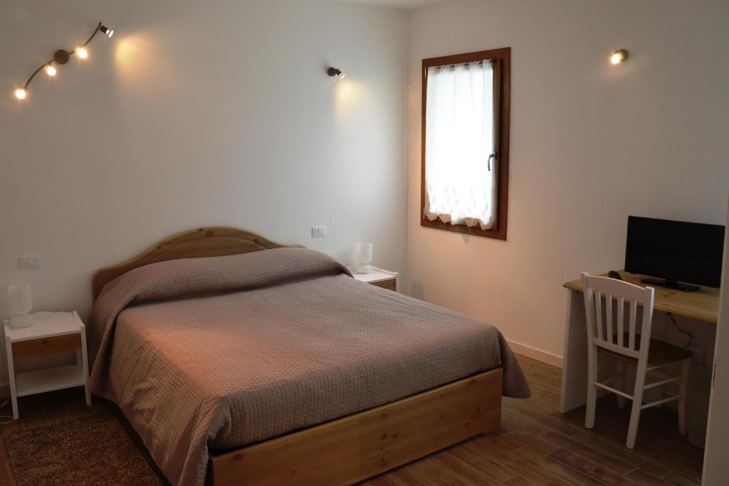 Postel nebo postele na pokoji v ubytování Hotel Agriturismo Al Luogo Del Giulio