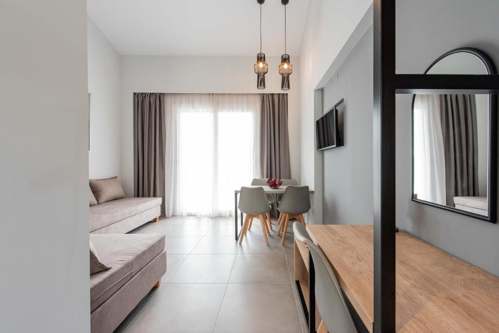 a living room with a couch and a table at Val Del Mar in Skala Fourkas