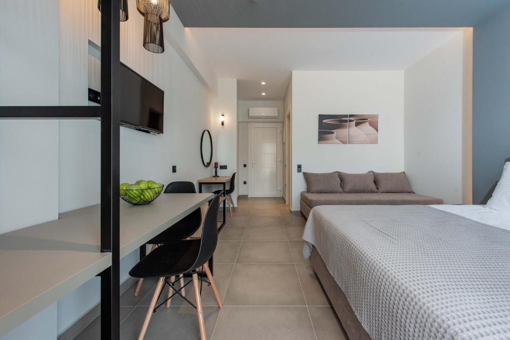 a hotel room with a bed and a desk at Val Del Mar in Skala Fourkas