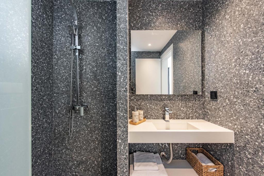 a bathroom with a sink and a mirror at Val Del Mar in Skala Fourkas