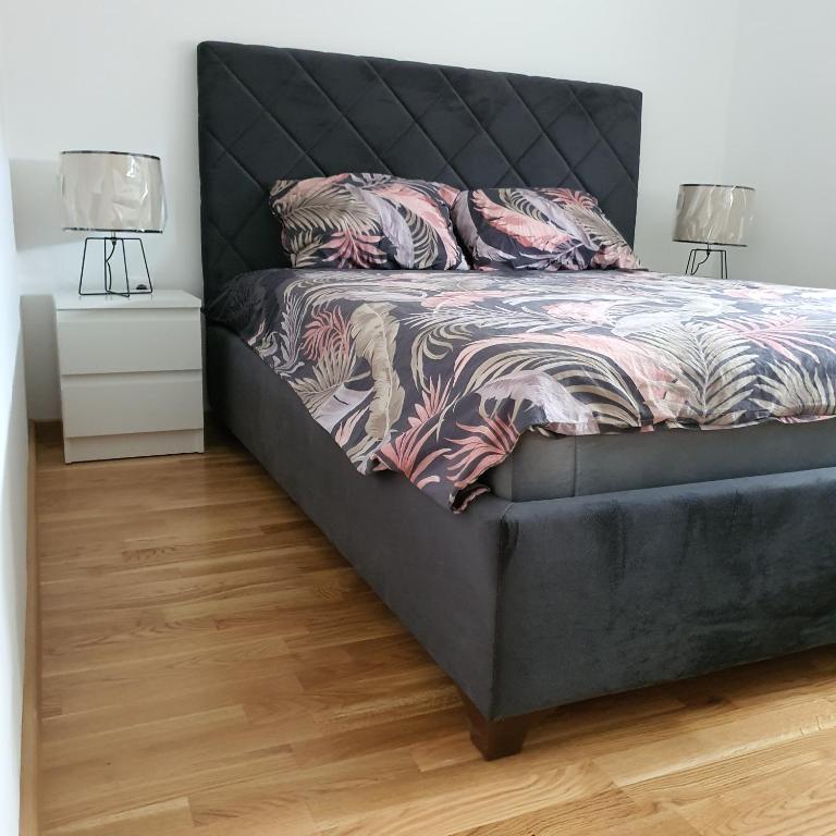 Postel nebo postele na pokoji v ubytování JR Lux apartman