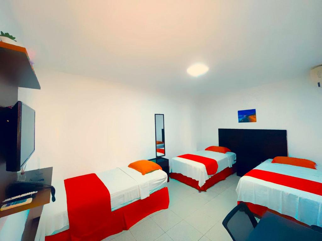 Postel nebo postele na pokoji v ubytování Hotel Madrigal
