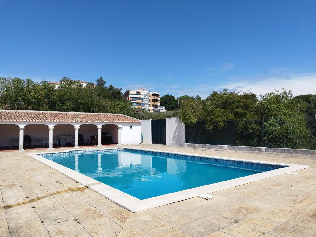 a swimming pool in the middle of a yard at Pátio Sant'Ana - 2 bedrooms villa w/ exterior area in Sesimbra