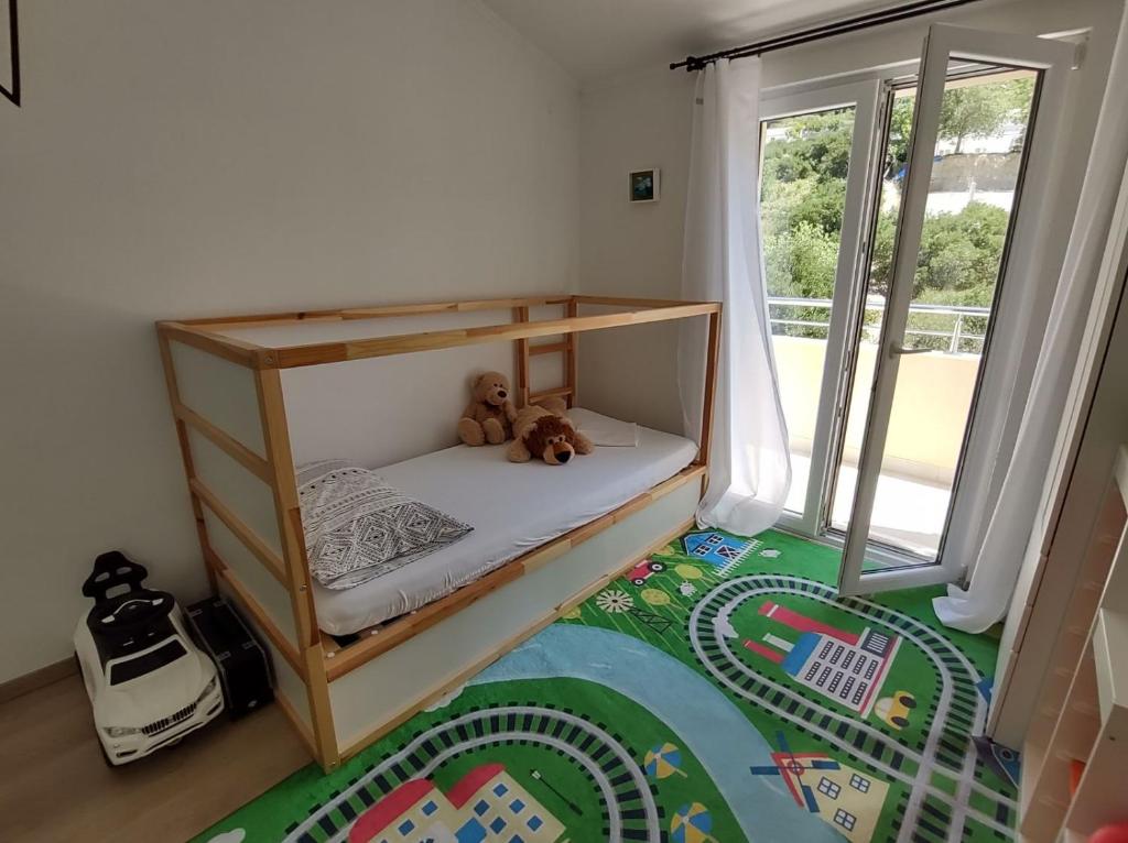 Posteľ alebo postele v izbe v ubytovaní Family Apartment Marton
