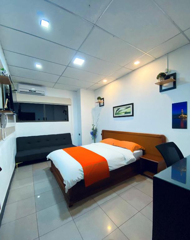 Postel nebo postele na pokoji v ubytování Hotel Madrigal