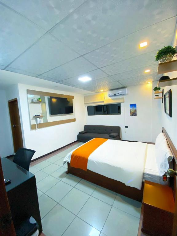 TV a/nebo společenská místnost v ubytování Hotel Madrigal