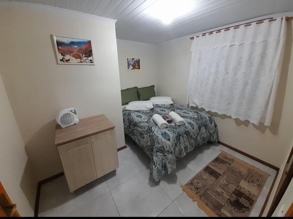 Postel nebo postele na pokoji v ubytování Casa e Flat Conforto Gramado