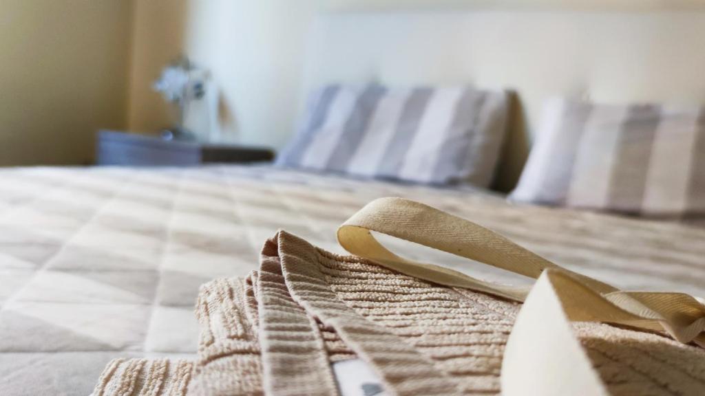 En eller flere senge i et værelse på Appartamento Girasoli in Franciacorta