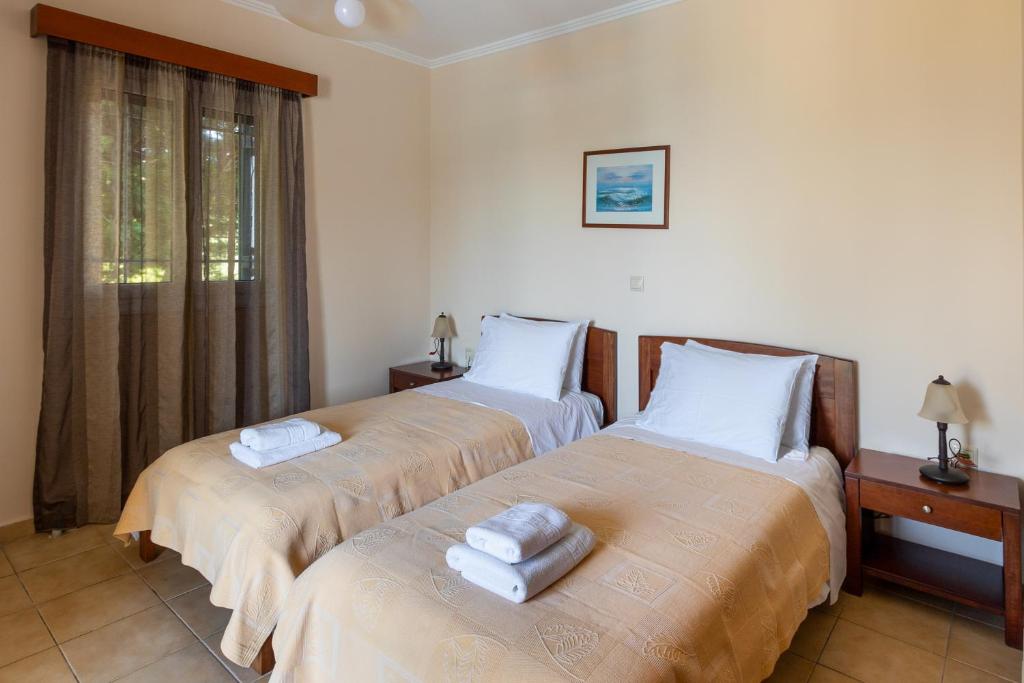 Postel nebo postele na pokoji v ubytování Villa Aphrodite