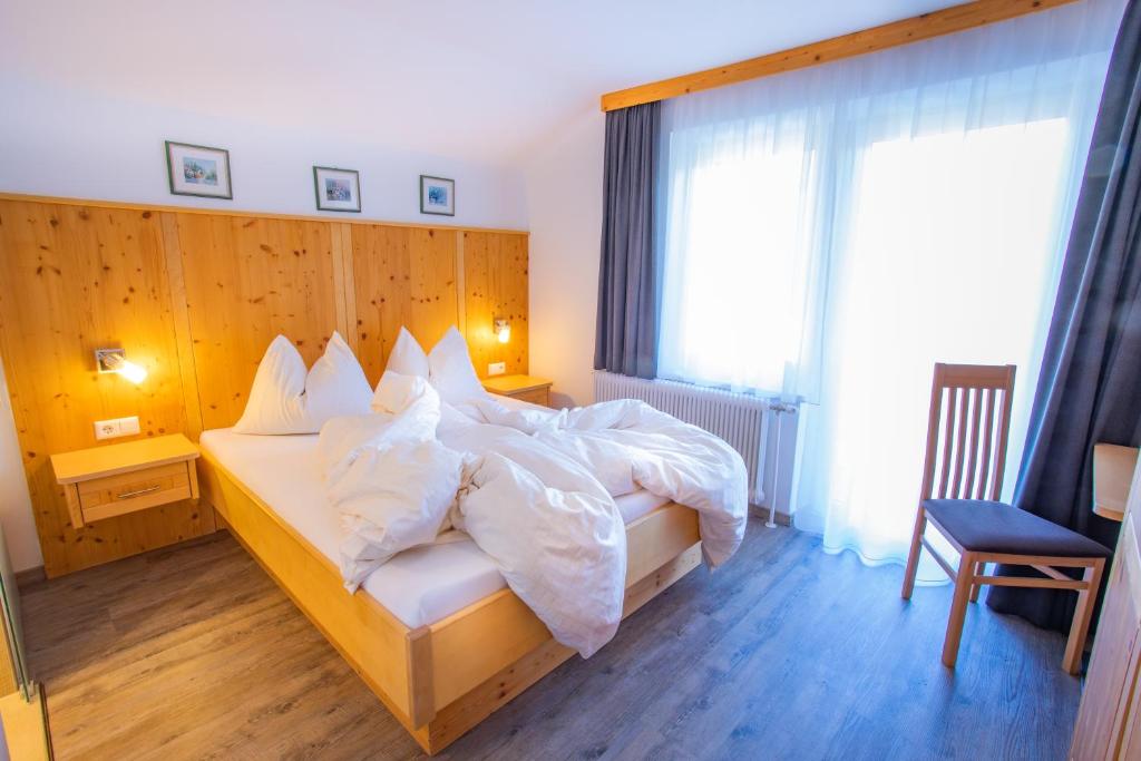 Postel nebo postele na pokoji v ubytování Bergerhof
