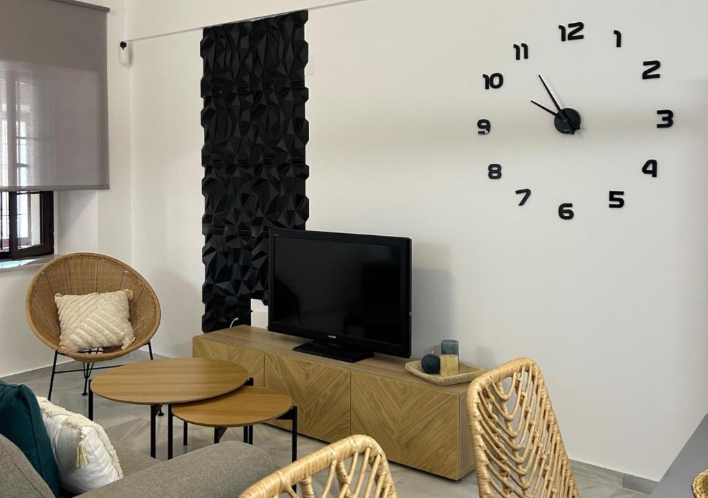 Televízia a/alebo spoločenská miestnosť v ubytovaní Apartamento Centro Cabildo Antiguo Convento