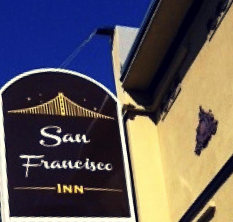 a sign that reads san francisco inn on a building at San Francisco Inn in San Francisco