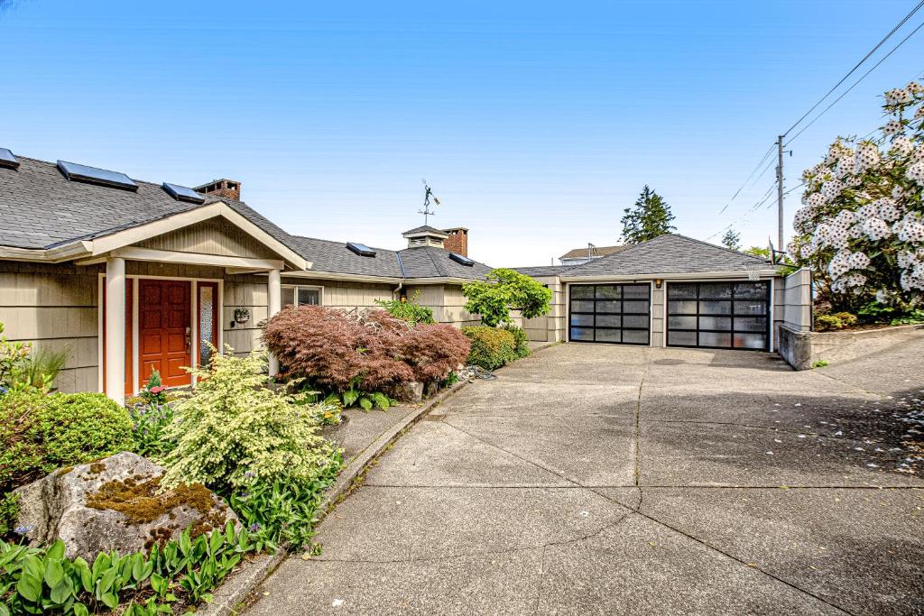 a house with a driveway and a garage at Memorable Views in Belfair