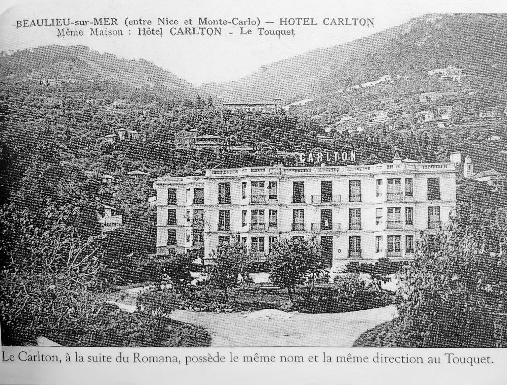 a black and white photo of a large building at Hotel Carlton in Beaulieu-sur-Mer
