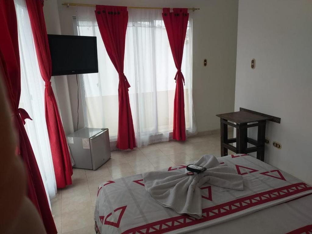 Postel nebo postele na pokoji v ubytování Hotel Luis Ángel