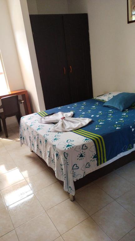 Postel nebo postele na pokoji v ubytování Hotel Luis Ángel