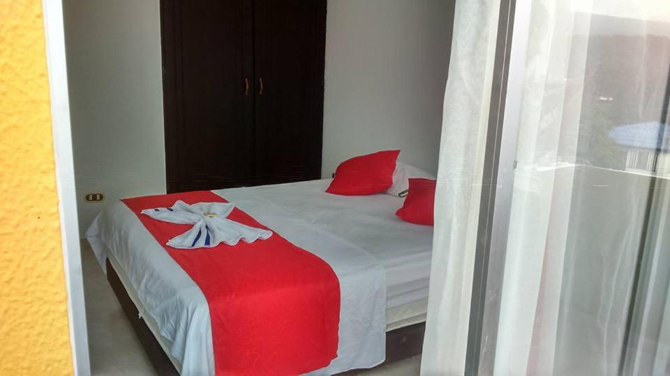 Postel nebo postele na pokoji v ubytování Hotel Luis Ángel