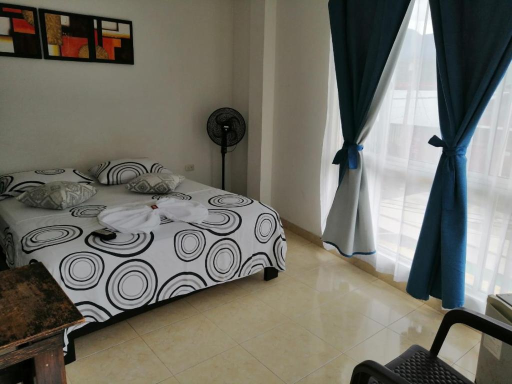 Postel nebo postele na pokoji v ubytování Hotel Luis Ángel