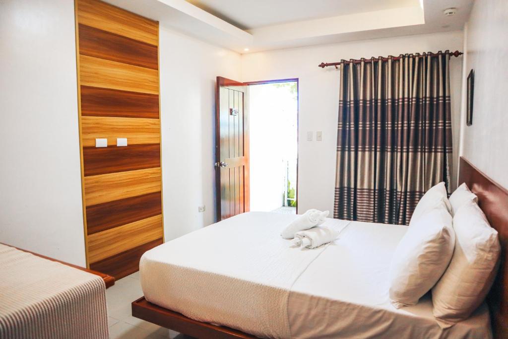 Postel nebo postele na pokoji v ubytování Youhan Beach Resort